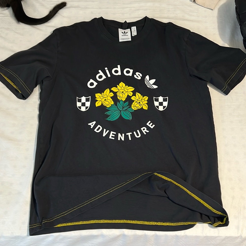 Unique Adidas tee with emblem and yellow flowers